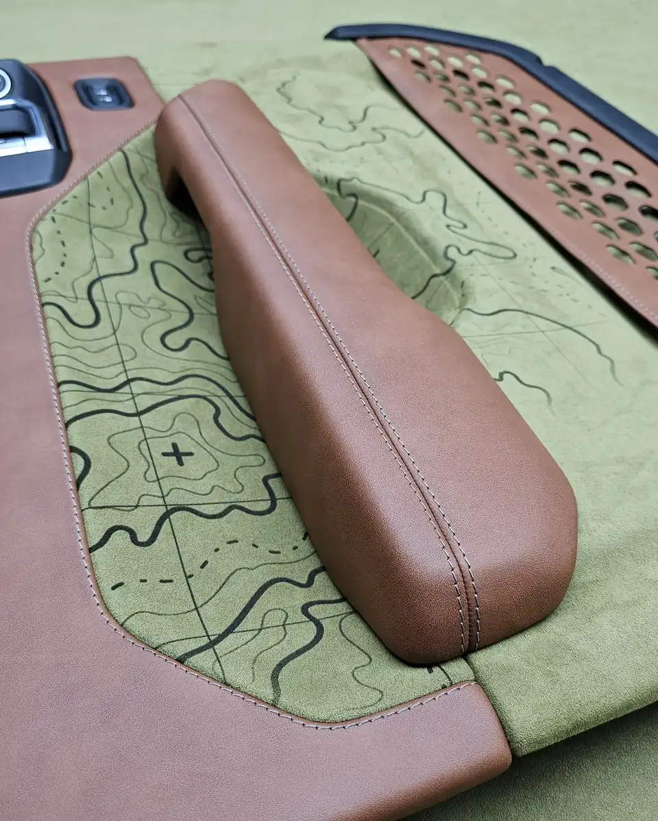 Jeep Wrangler door in sage suede with a stitched topographic map